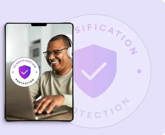 Atlas HXM Classification Protection badge over a tablet showing a contractor at work