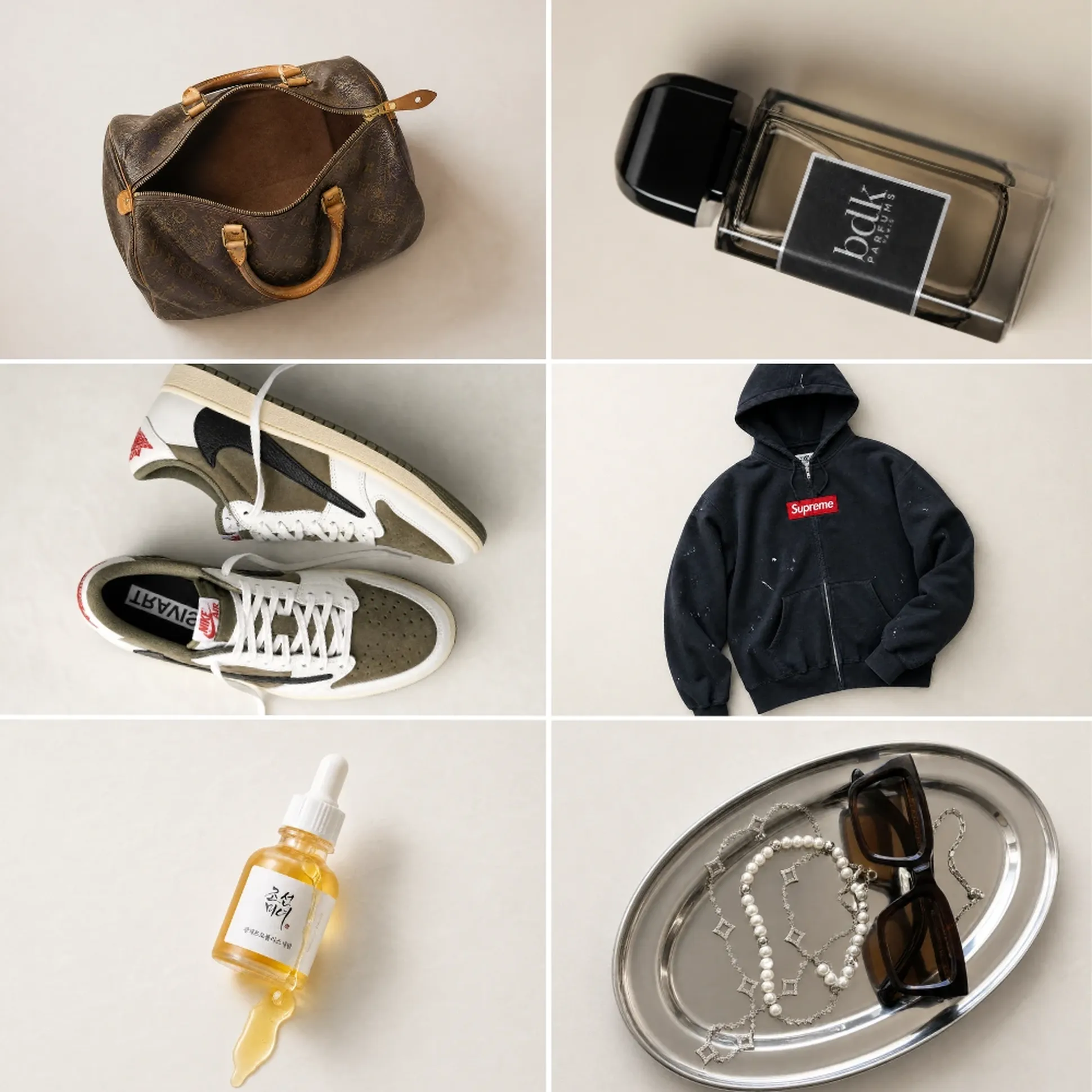 Collection of fashion items: brown bag, perfume bottle, sneakers, black hoodie, dropper bottle, and sunglasses with pearl necklaces on a tray.