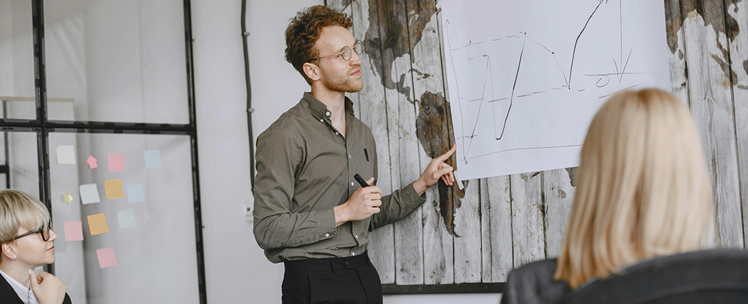 Manager explaining business growth strategy during a collaborative office meeting