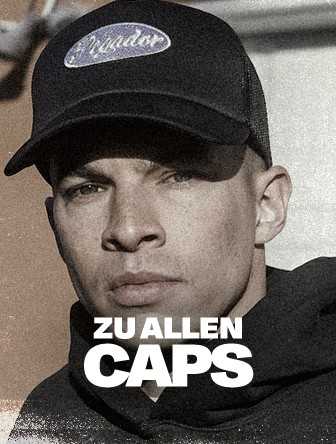Person wearing a dark cap with "Zu Allen Caps" text overlayed, gazing forward, in a shaded, monochromatic setting.