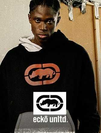 Person wearing a black hoodie with a red rhino logo and "ecko unltd." text, stands against a partially visible background.