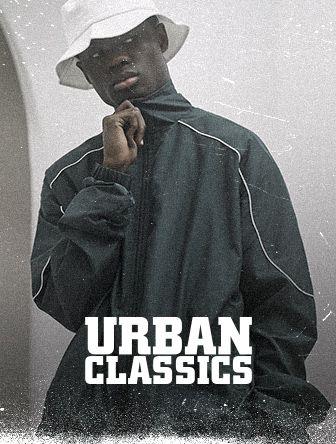 A person in a dark jacket and white bucket hat poses thoughtfully. Text reads "Urban Classics." The style is vintage and gritty.
