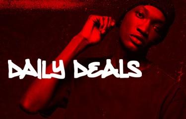 Person posing with a serious expression, wearing a beanie, under red lighting. Text overlay reads "DAILY DEALS."