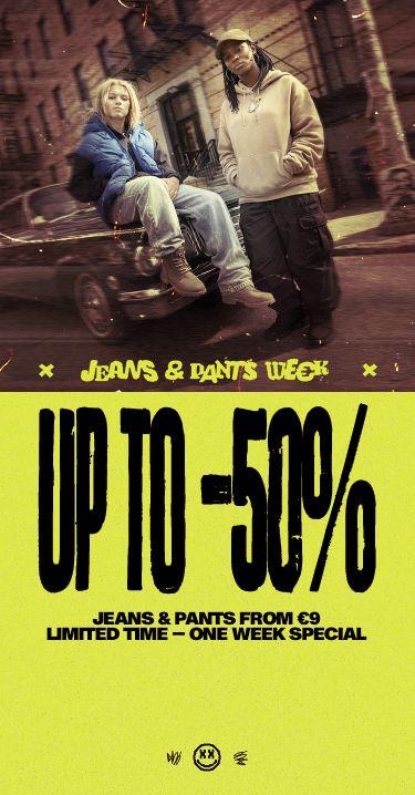 Two people pose on a car in urban setting; bold text reads "Up to -50%" on yellow background, promoting jeans and pants sale.