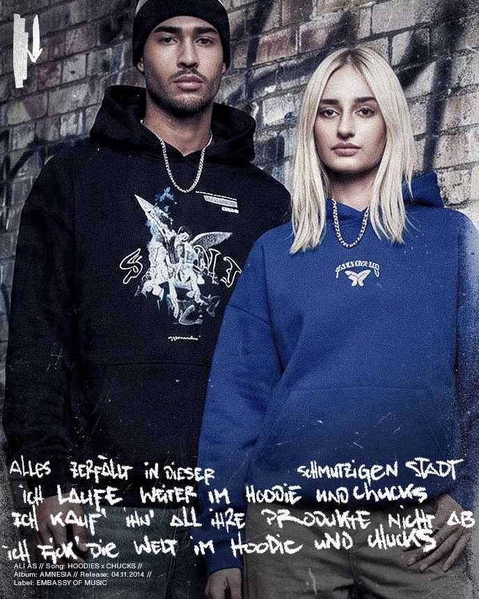 A man in a black hoodie and a woman in a blue hoodie stand against a graffiti-covered brick wall. German lyrics overlay the image.