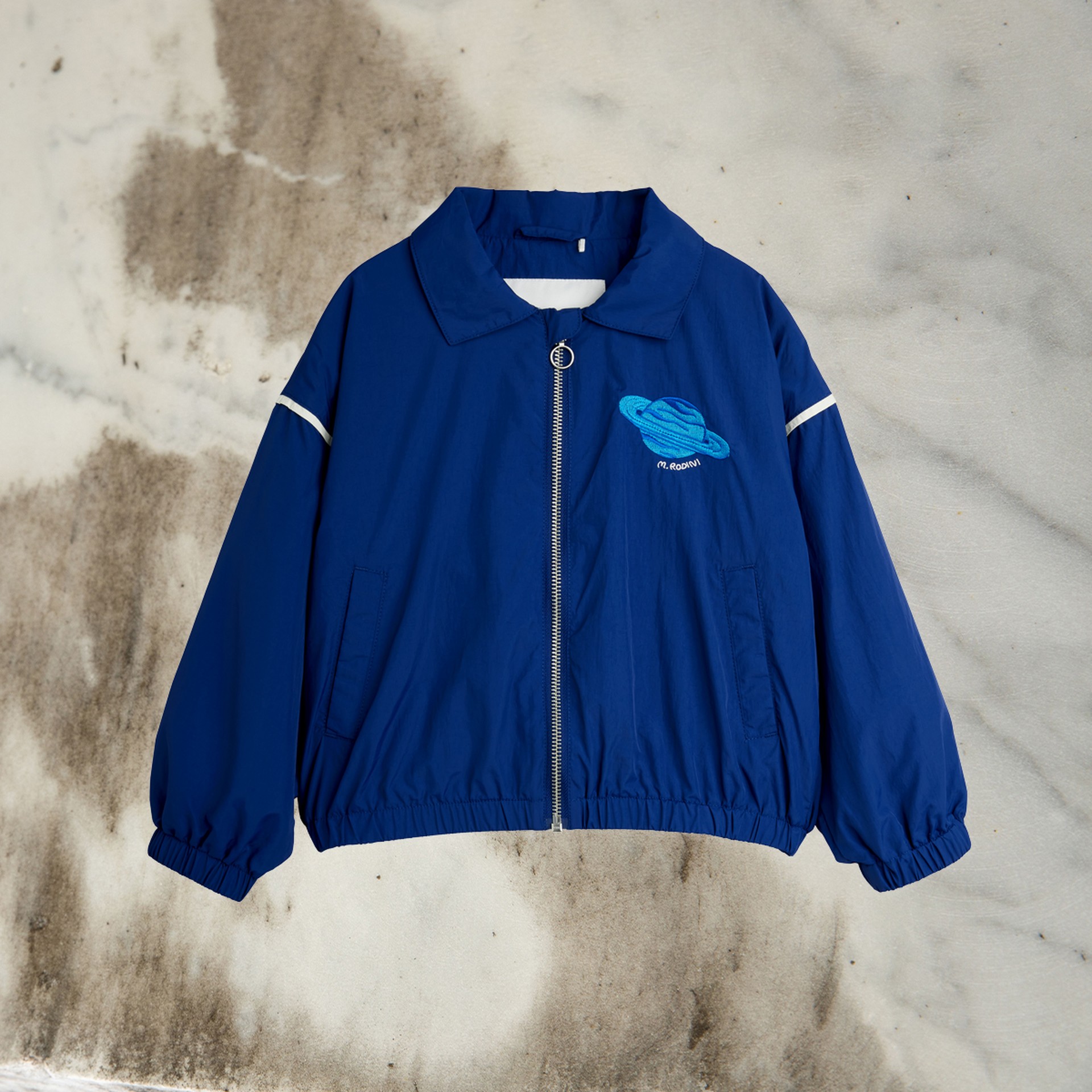 Planet embroidered nylon jacket in blue from Mini Rodini