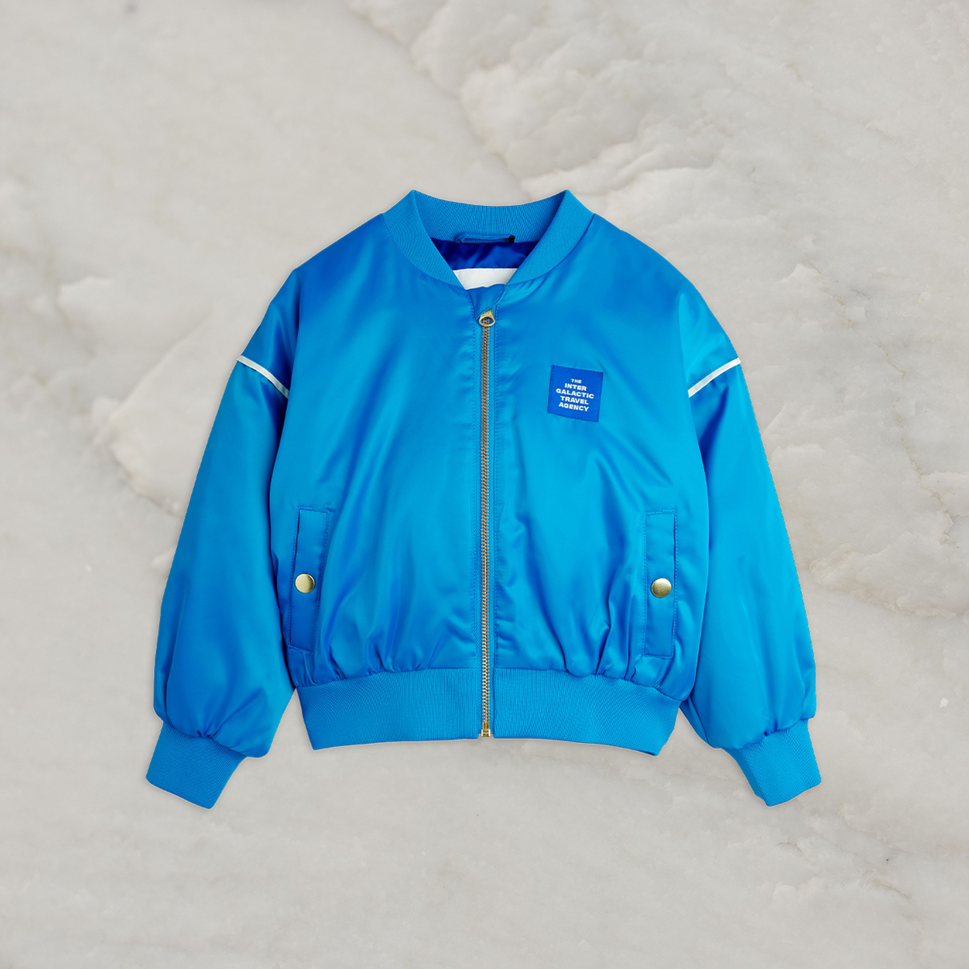 Image of Travel agency chenille satin baseball jacket in blue from Mini Rodini