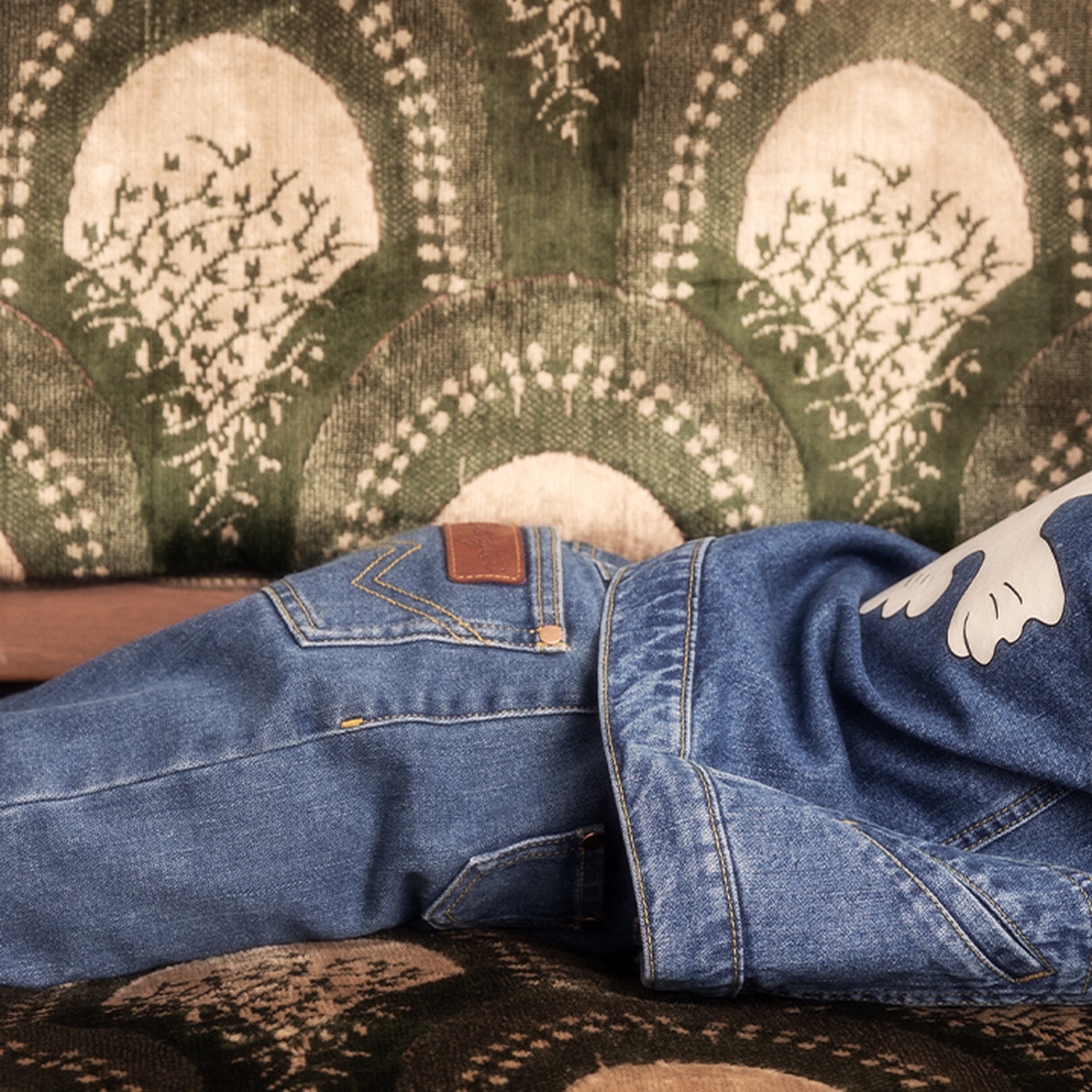 Girl wearing Mini Rodini x Wrangler Denim jacket