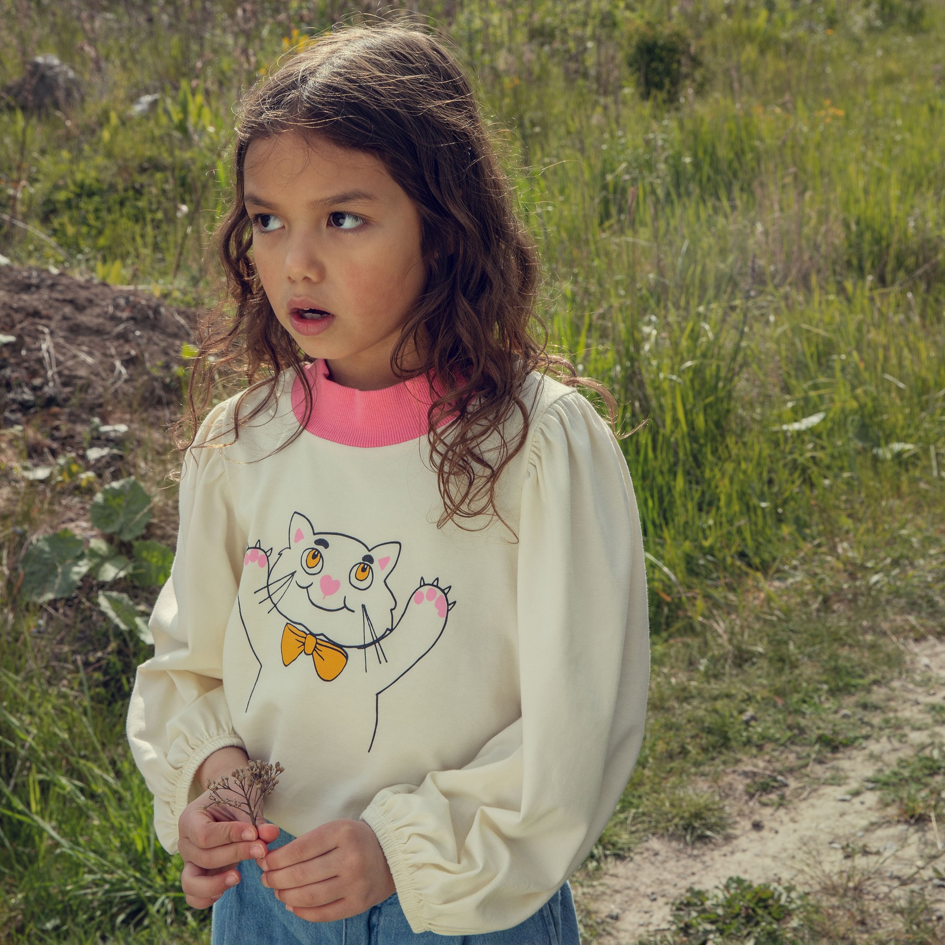 Girl wearing cat balloon sweater from Digging Deep collection Mini Rodini