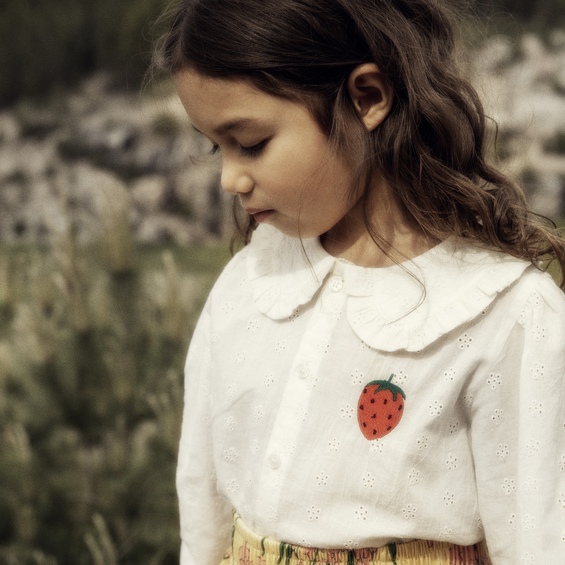 Girl wearing Strawberry schiffli blouse from Mini Rodini