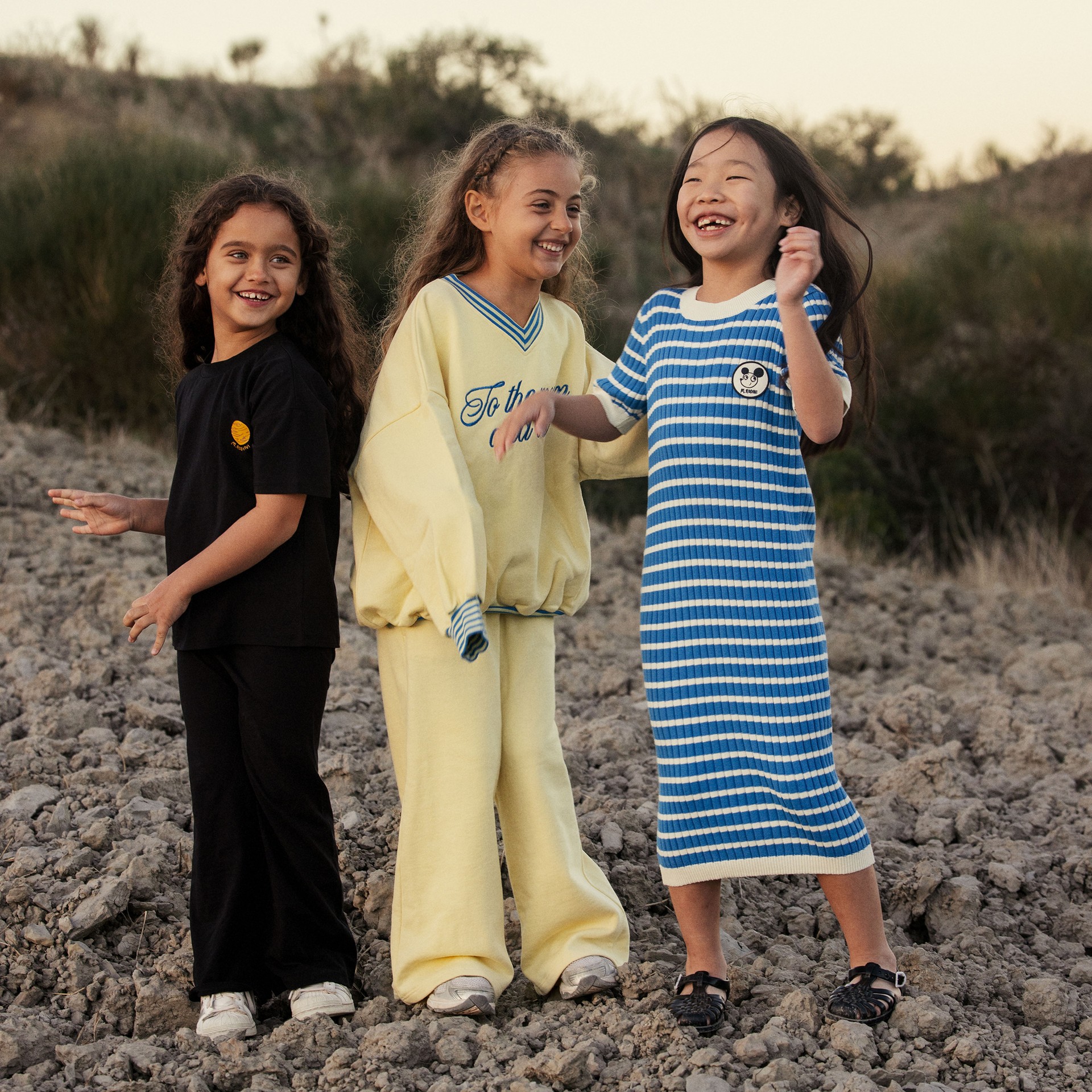 3 girls wearing Alien Affairs collection from Mini Rodini