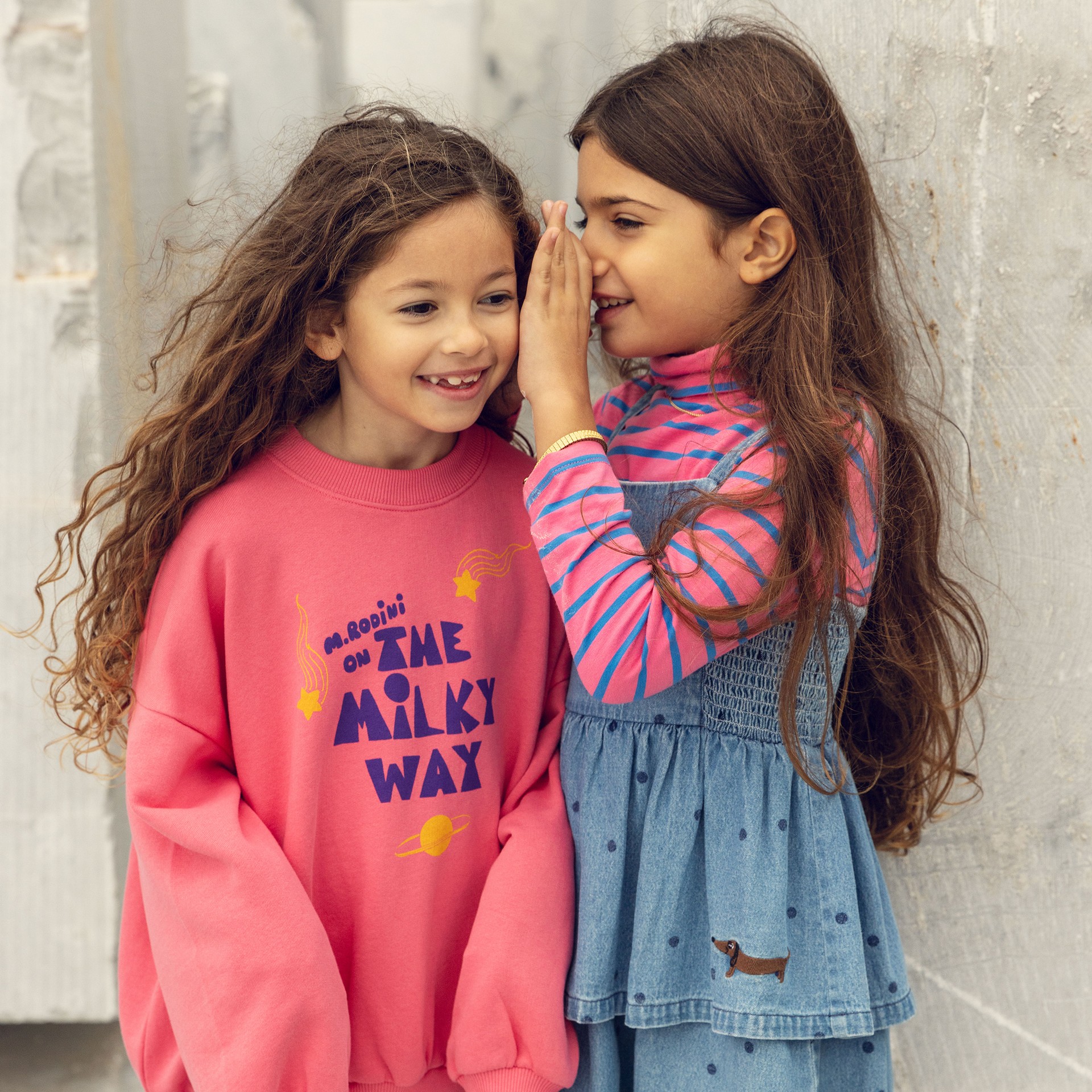 Two girls wearing Alien Affairs collection from Mini Rodini