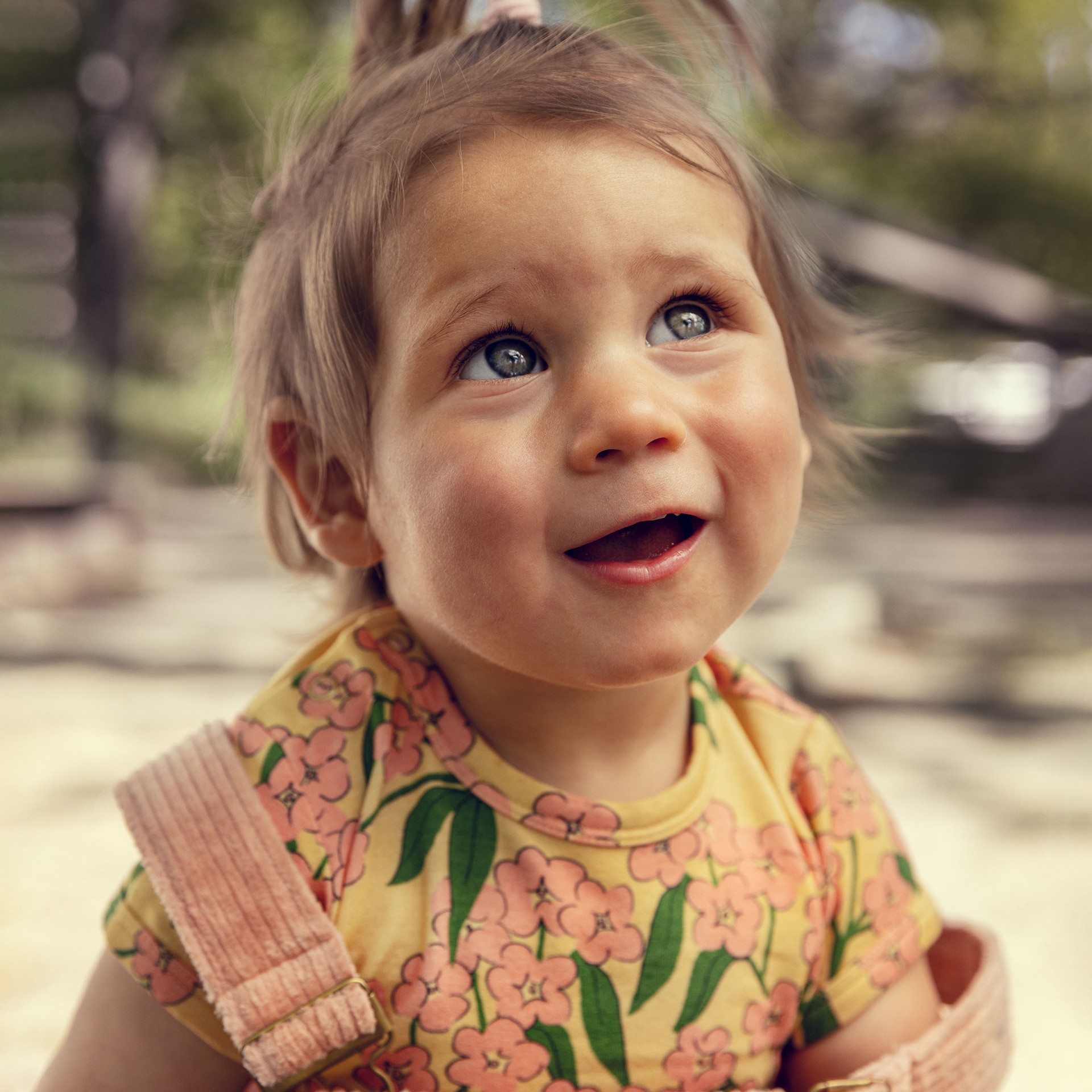 Baby wearing alpine flower T-shirt