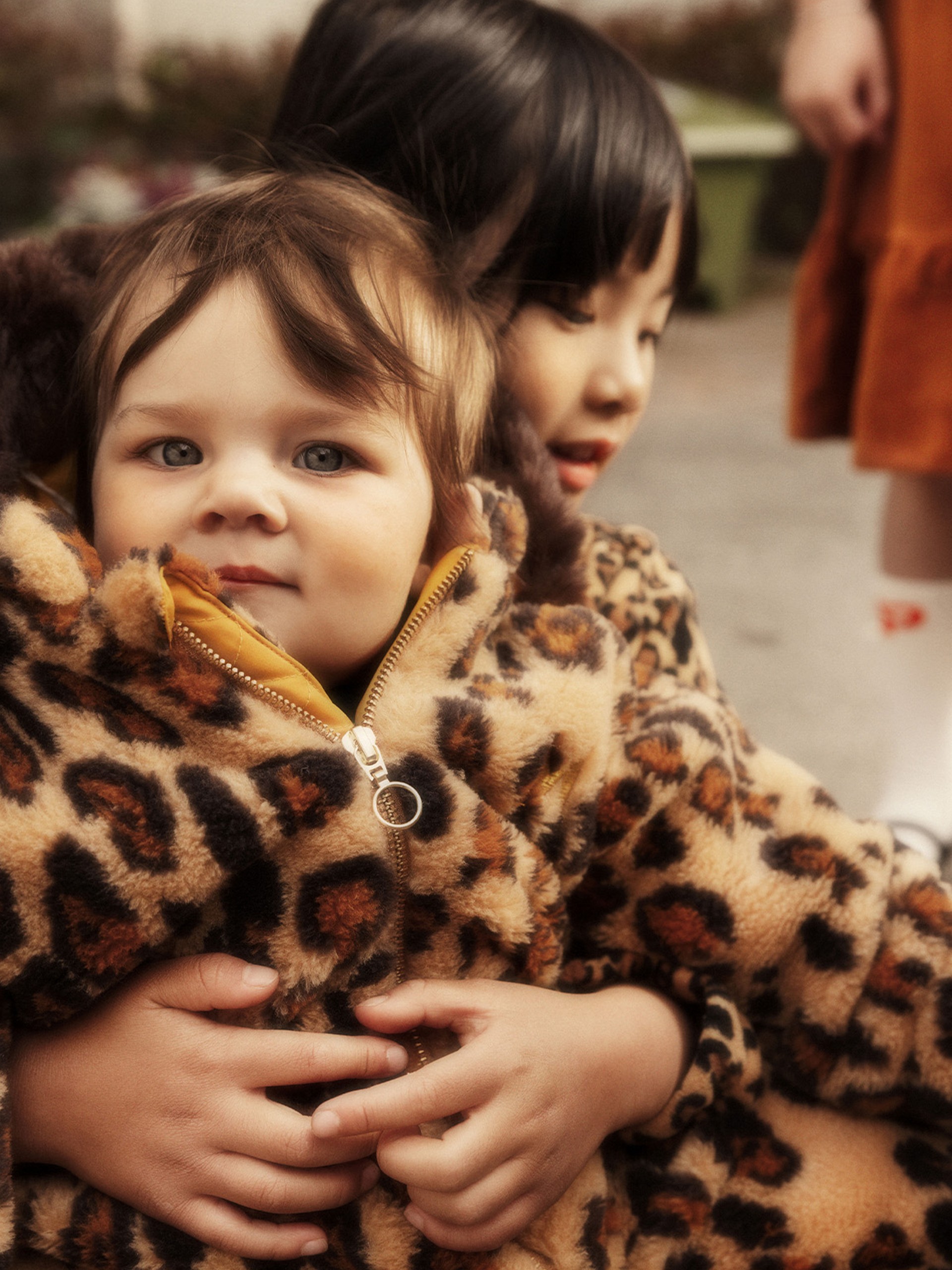 Baby wearing Leopard Faux Fur Baby Overall from Mini Rodini