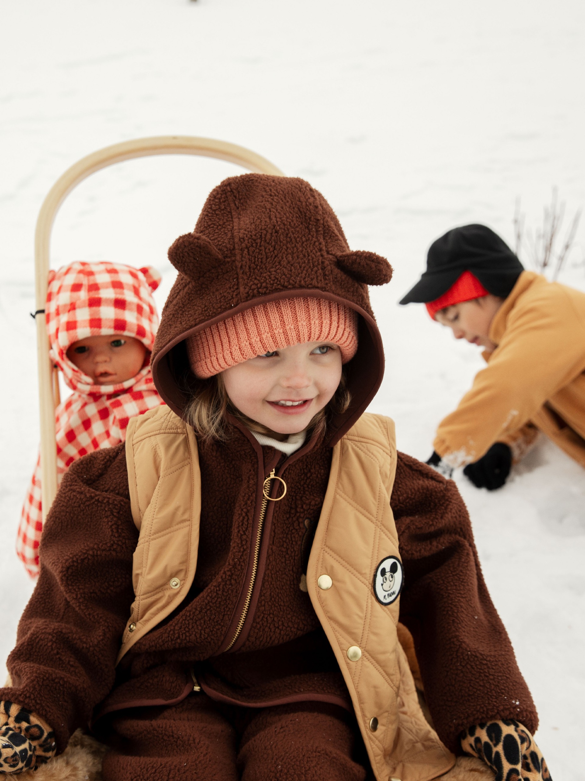 Girl wearing Bear pile trousers and Bear pile jacket in winter landscape from Mini Rodini