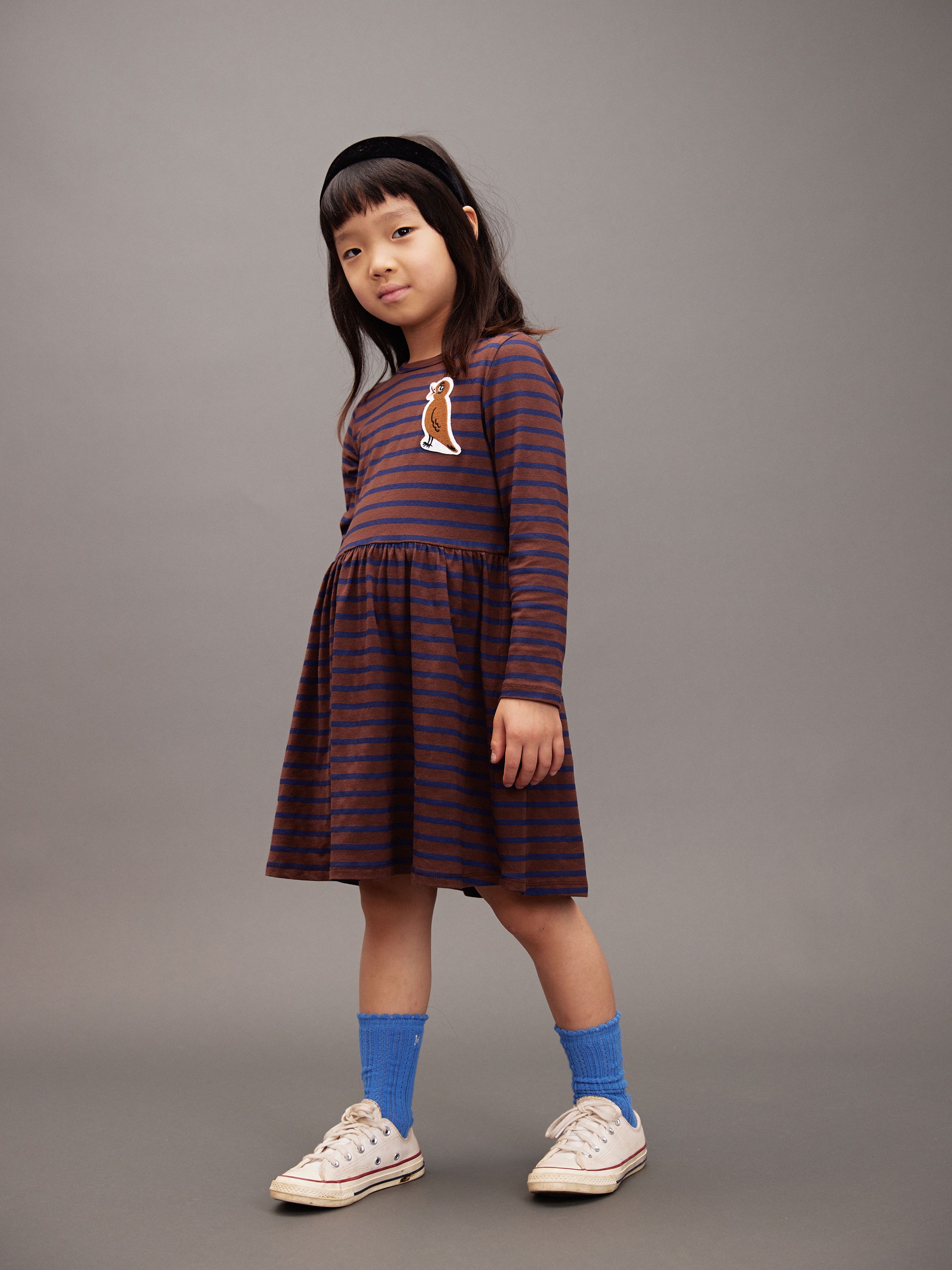 Girl wearing Stripe bird patch dress from Mini Rodini
