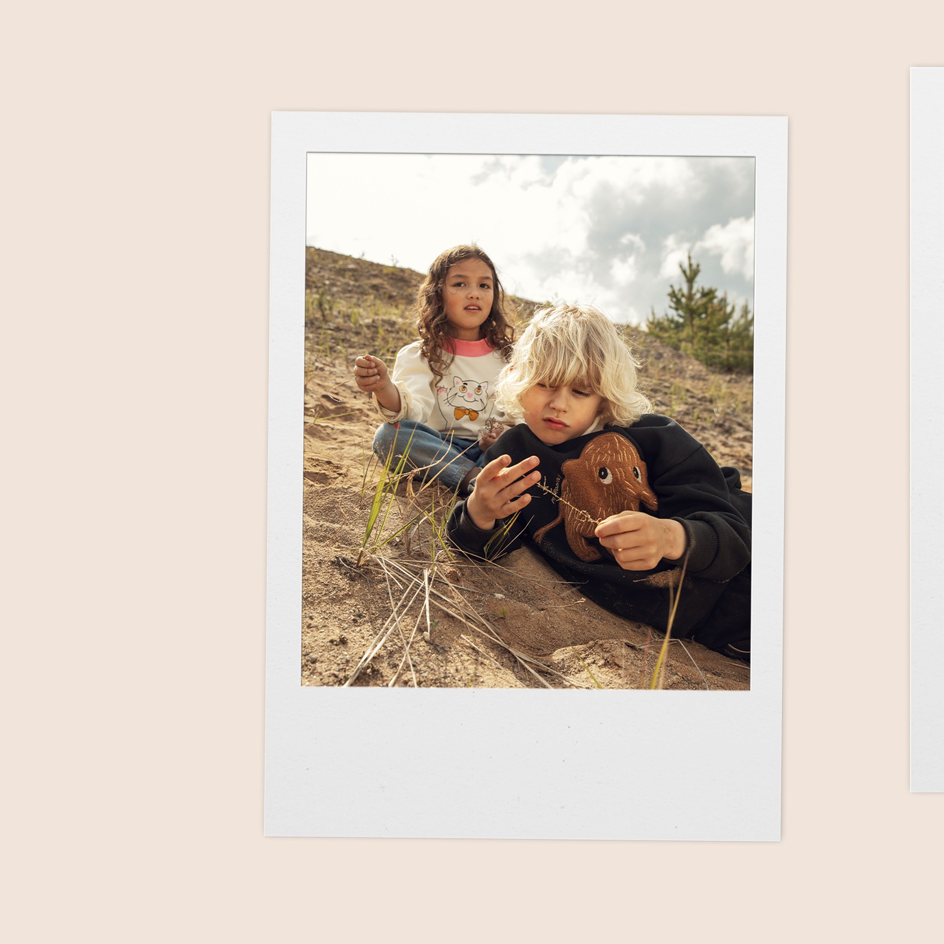 Polaroid image of boy wearing Mammoth sweatshirt from new collection Digging Deep Mini Rodini