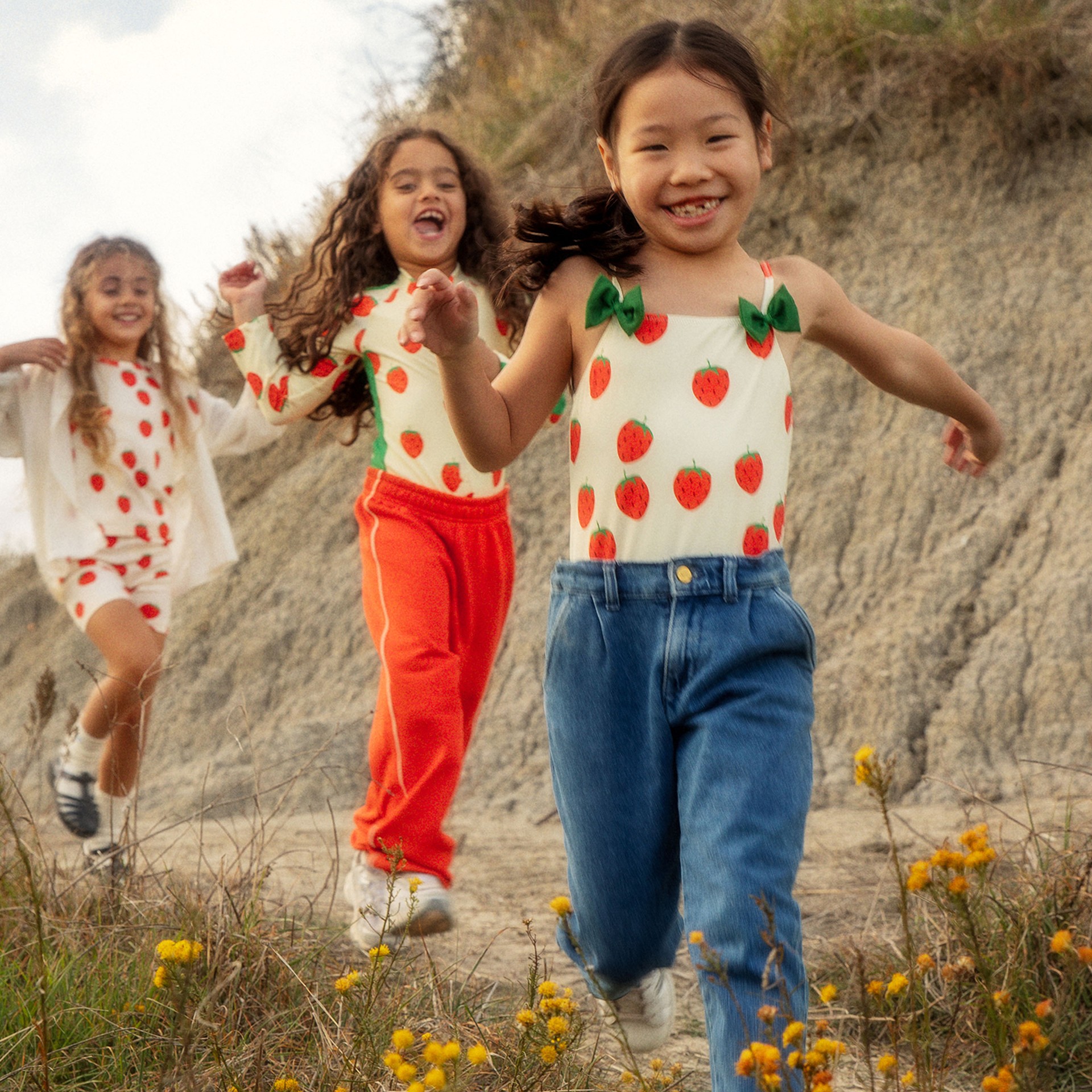 Girls wearing Strawberries print from Mini Rodini
