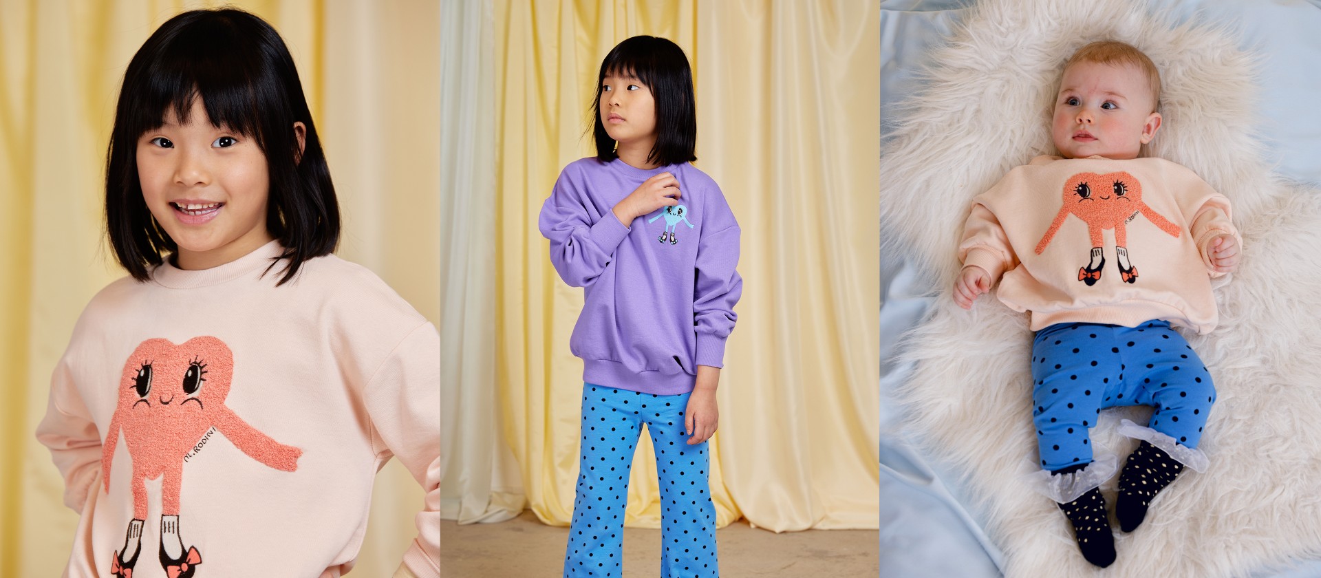 Girl wearing Heart in shoes embroided sweatshirt in purple matched with Polka dots flared trousers in blue from Mini Rodini Things to love collection