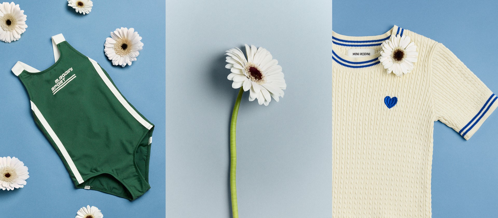 Poplin shirt from Mini Rodini Table Tennis collection with daisies on a blue background, set against a large white daisy backdrop.
