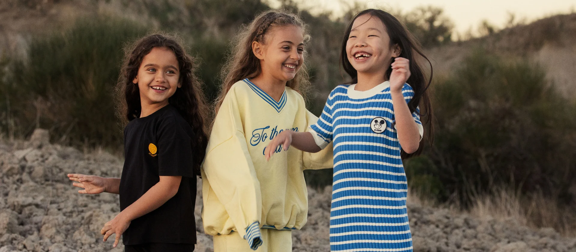 3 girls wearing Alien Affairs collection from Mini Rodini