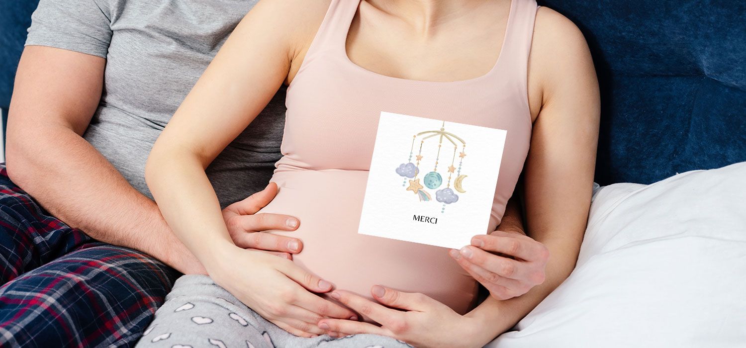 woman holding a thank you card