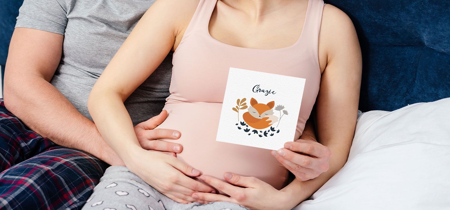 woman holding a thank you card