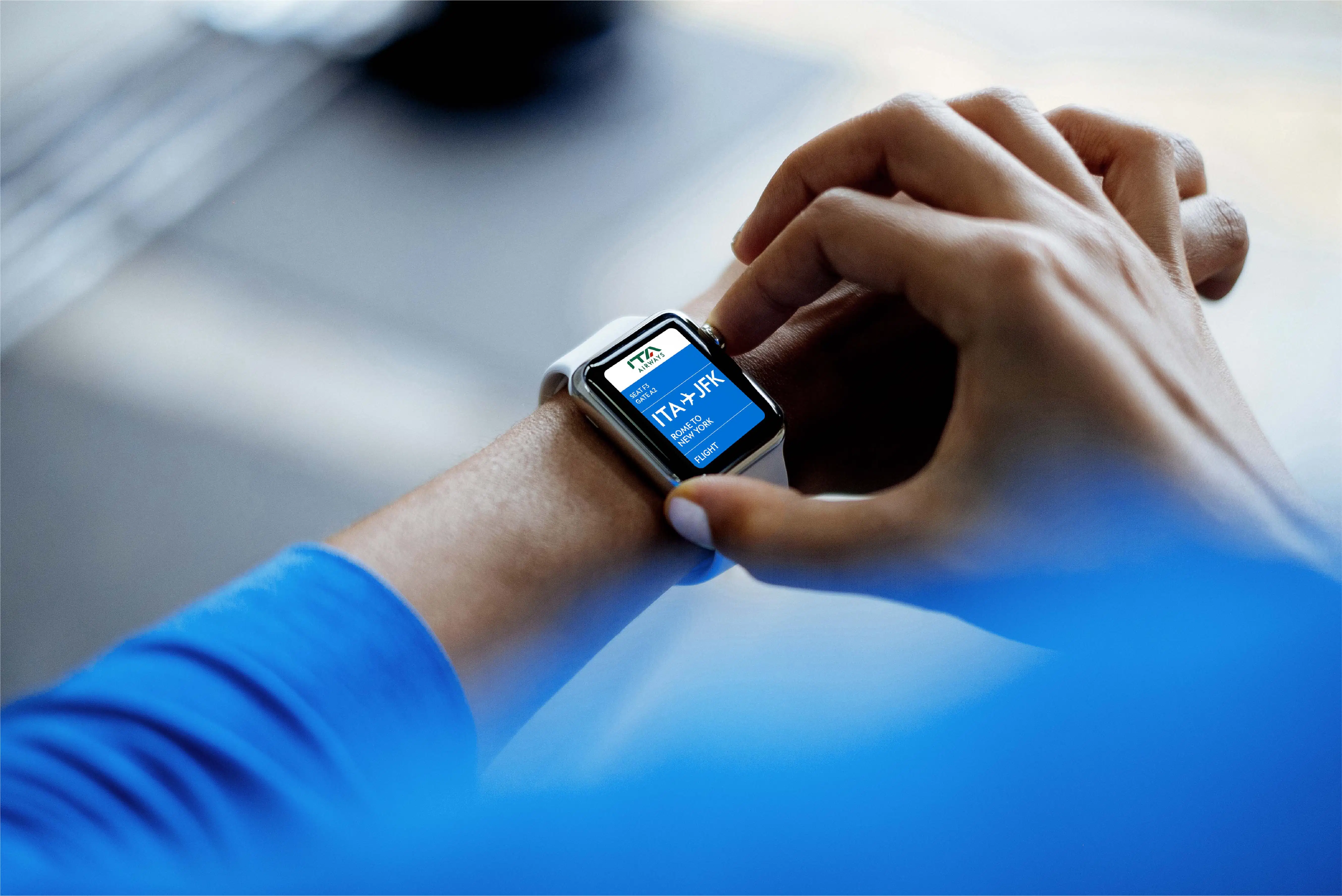 Smartwatch showing ITA Airways ticket