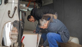 A cabinet being taken away by registered waste carrier to stop fly tipping in Wales