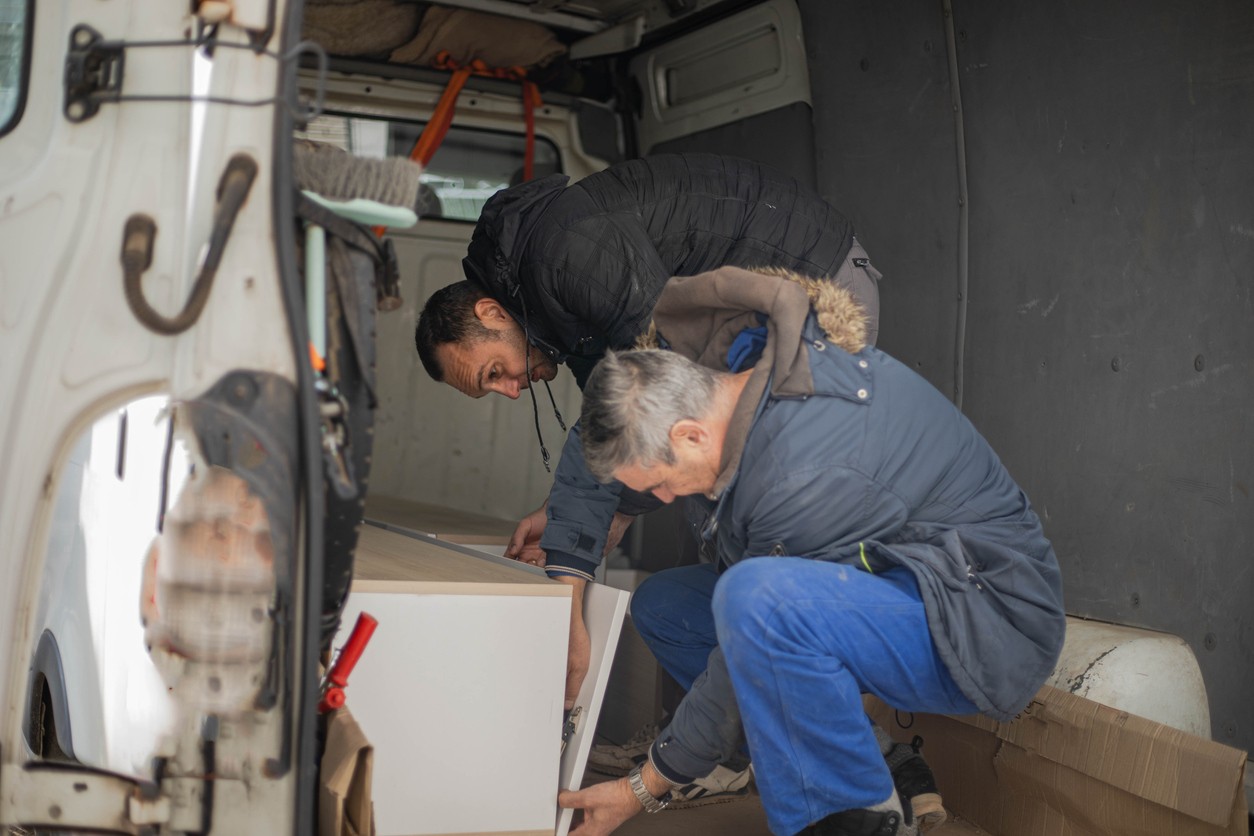 A cabinet being taken away by registered waste carrier to stop fly tipping in Wales