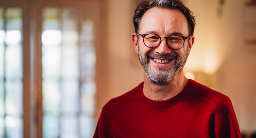 A man smiling at the camera