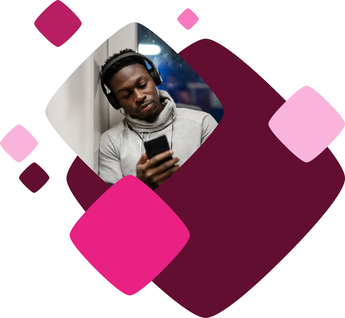 Man with headphones on, looking at a smartphone, against a geometric background of overlapping maroon and pink shapes.