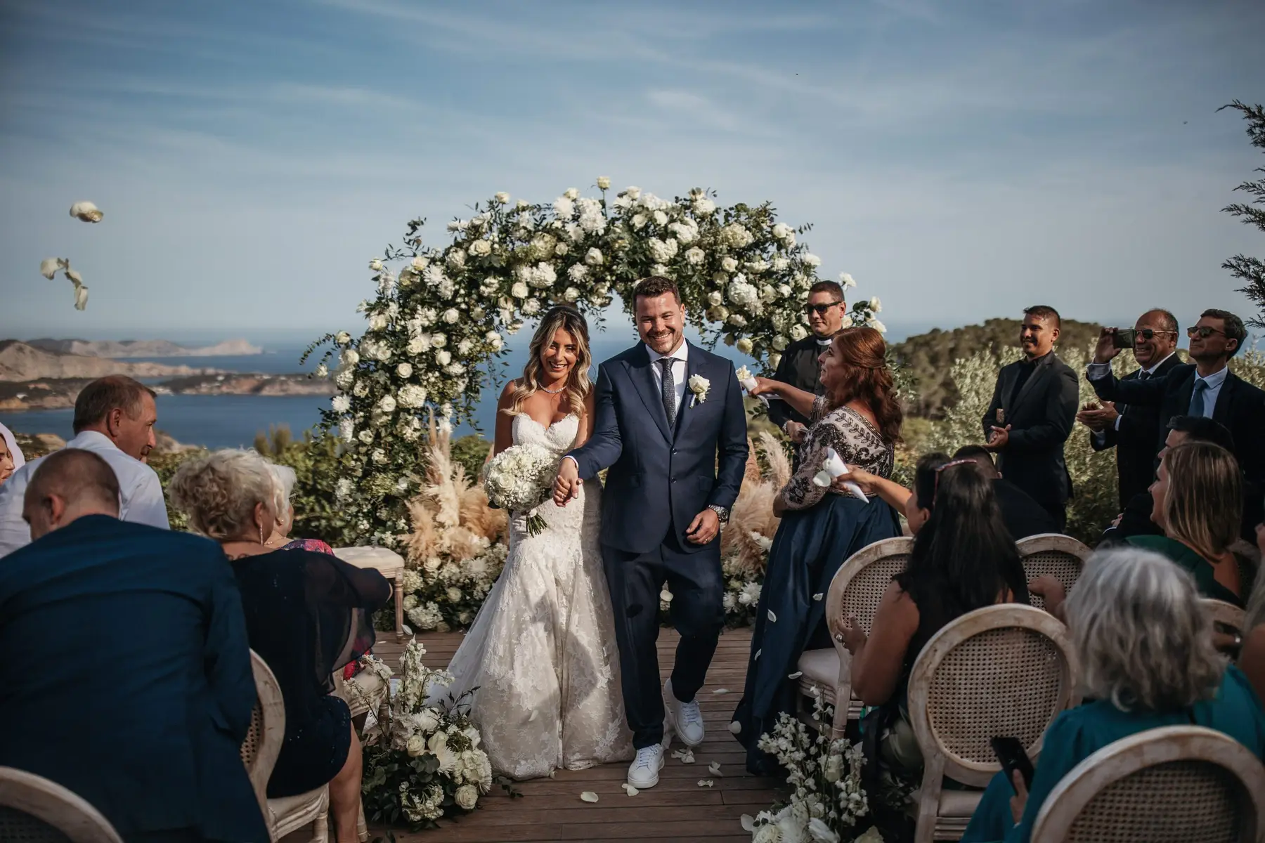 Ibiza wedding couple exiting sea view villa ceremony