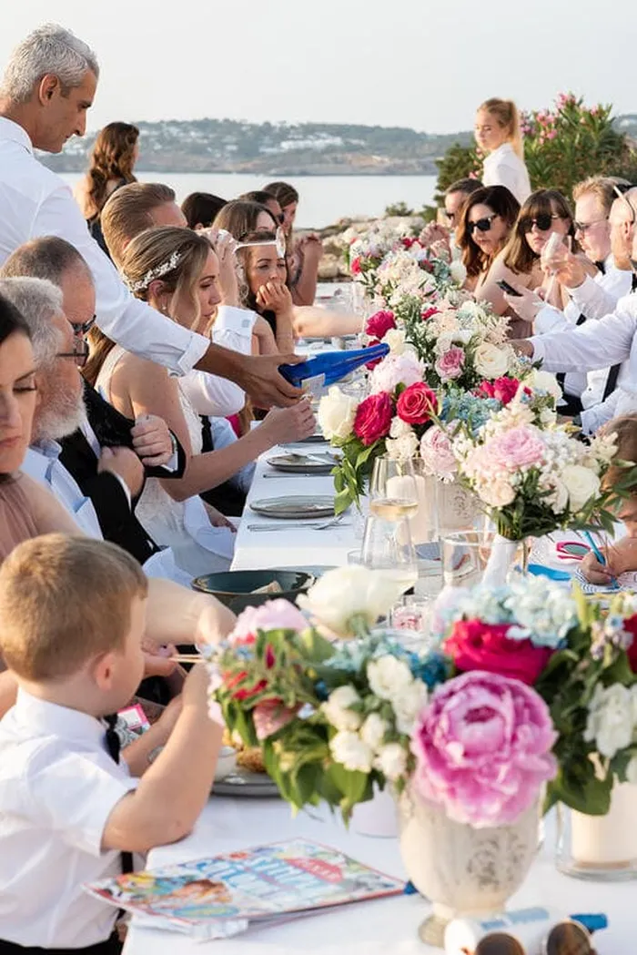 Bride and groom terrace portrait sea backdrop