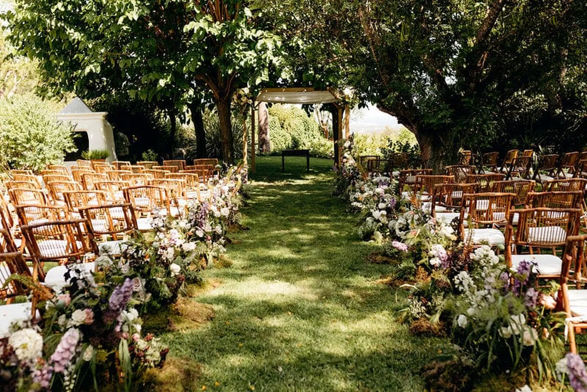 finca wedding ceremony setting with flowers organized by top ibiza wedding planner