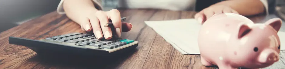 woman-hand-writing-documents-using-calculator