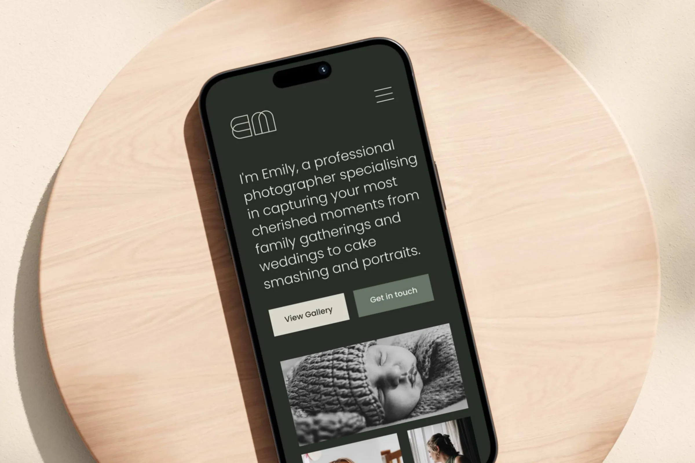 A smartphone showing the website homepage and examples of their photography