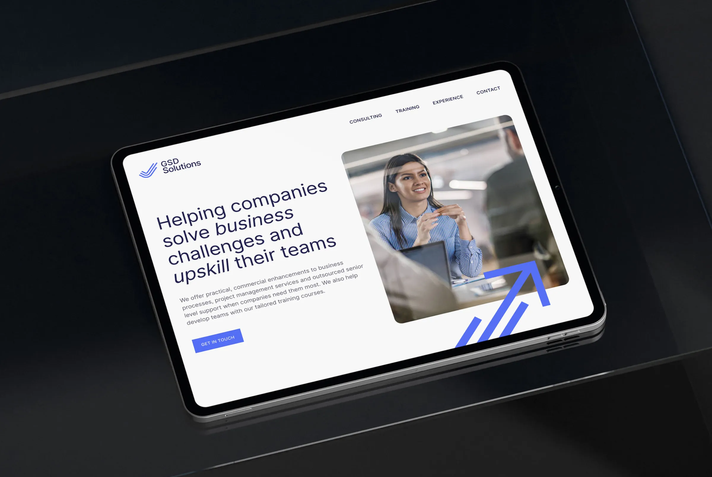 The website homepage shown displayed on an iPad