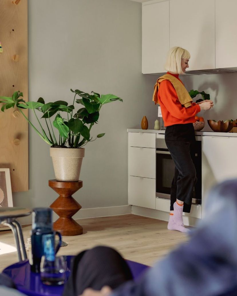 Residents relaxing in living space of apartment