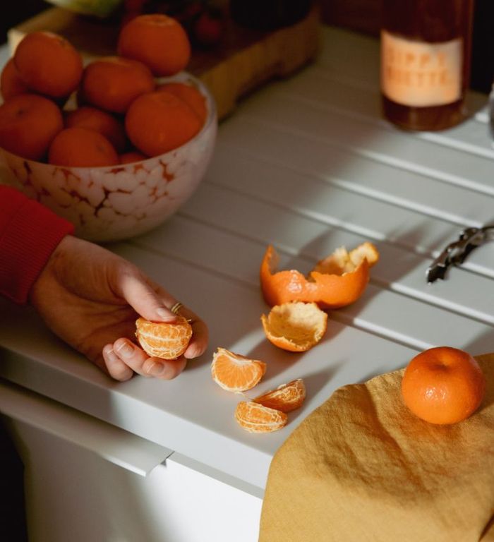 Morro resident peeling orange