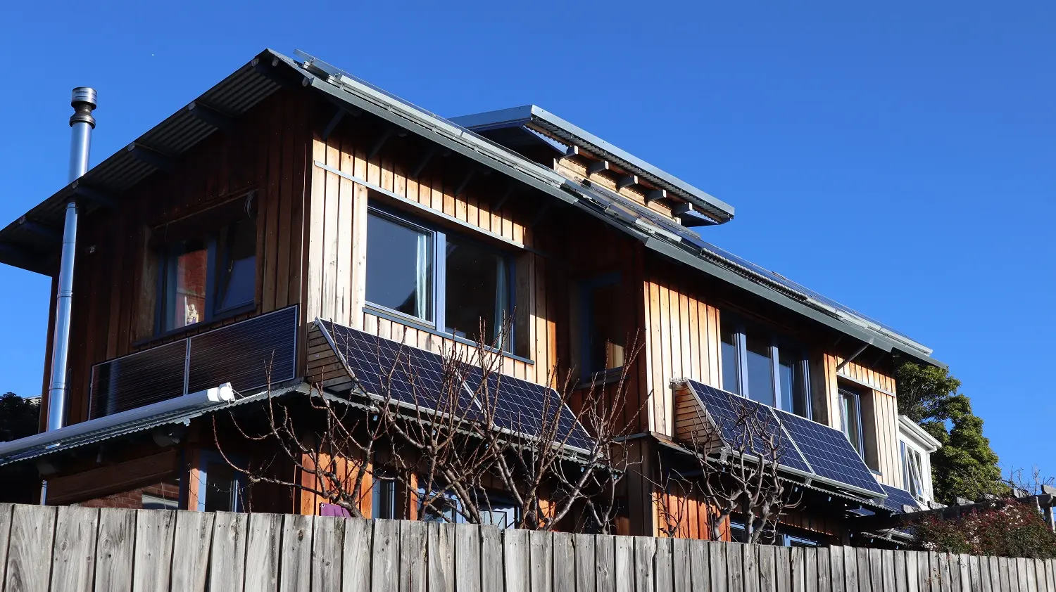Solar PV 6 250 panel on front of house 2 Enfhase In eastern Facade and 6 310 watt on top roof Energy Tower my-PV