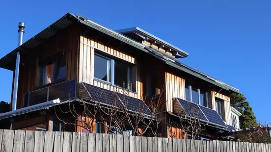 Solar PV 6 250 panel on front of house 2 Enfhase In eastern Facade and 6 310 watt on top roof Energy Tower my-PV