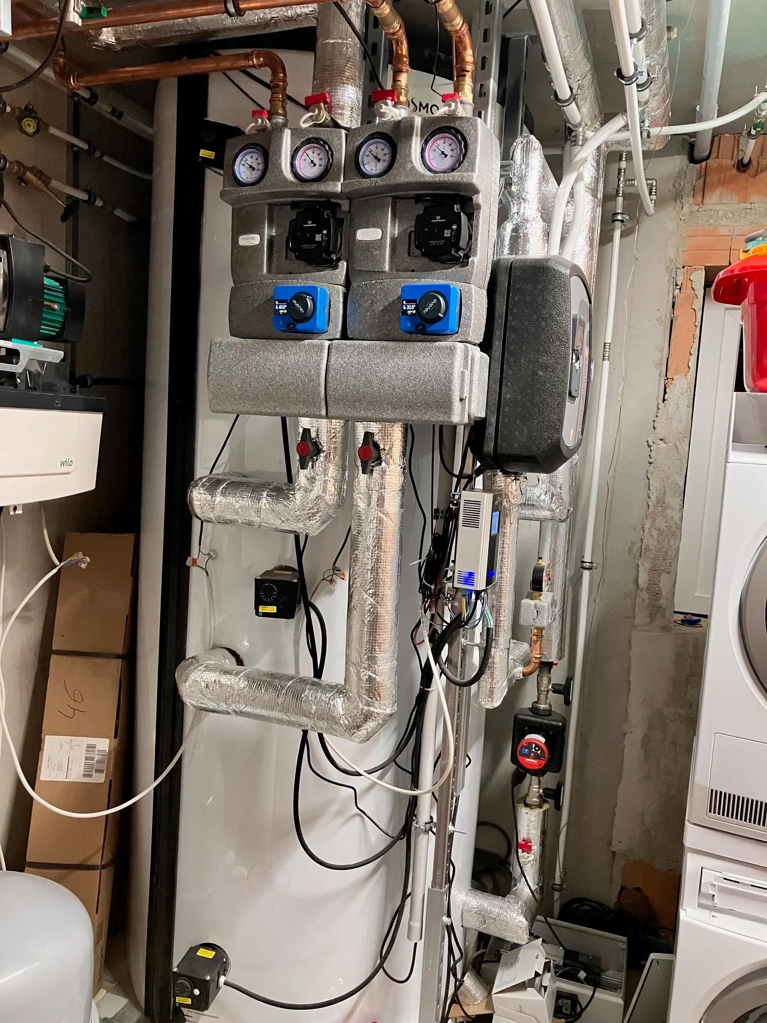 Buffer tank with installed AC•THOR, showing various connections and displays.