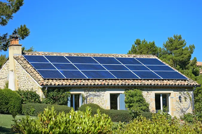 PV system on a roof of a typical French country house
