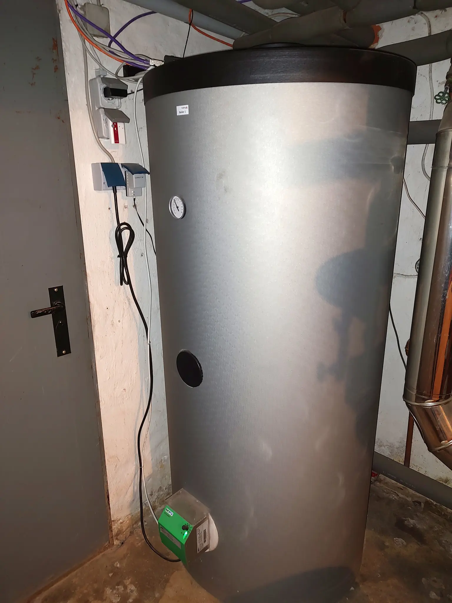 Basement boiler with installed AC ELWA-E for using PV surplus to heat domestic hot water.