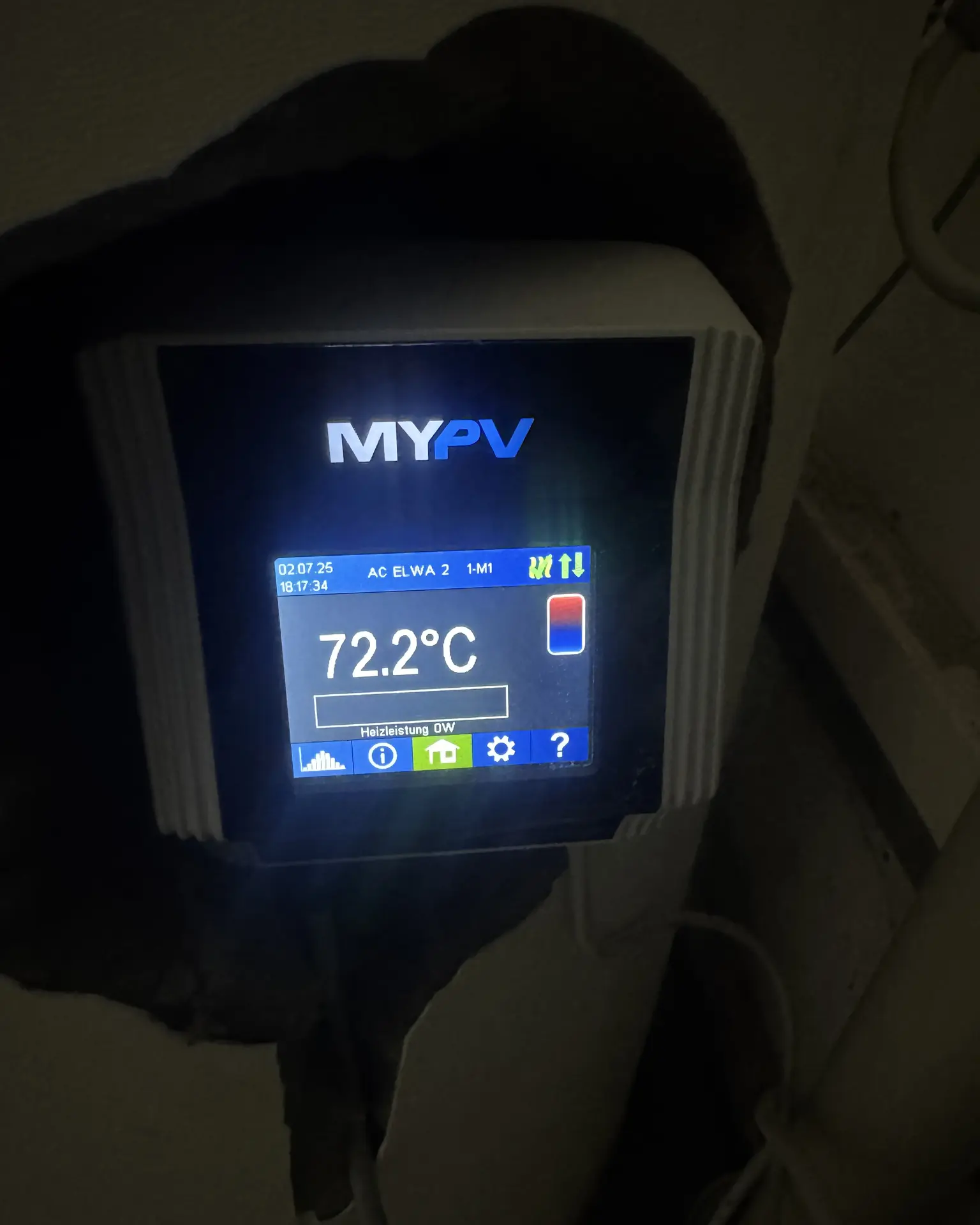 A digital display shows 72.2°C on a MY-PV device mounted on a wall, displaying various control settings and indicators.