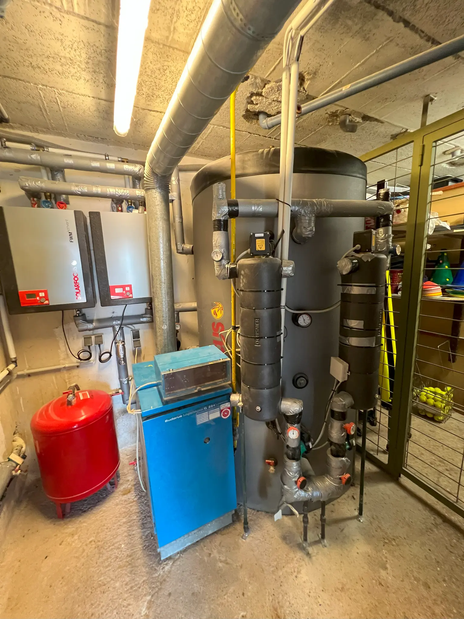 Heating room in the basement with a water heater.