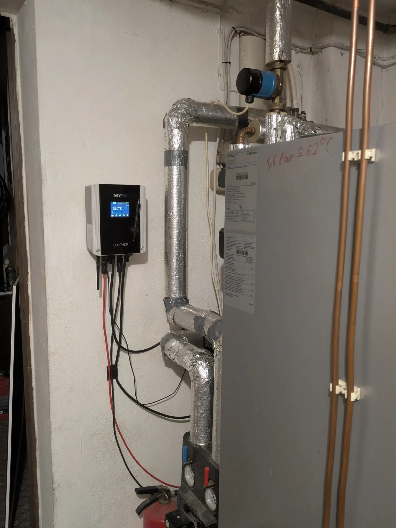 SOL•THOR installed in the basement for hot water generation, connected to a storage tank and powered by solar energy.