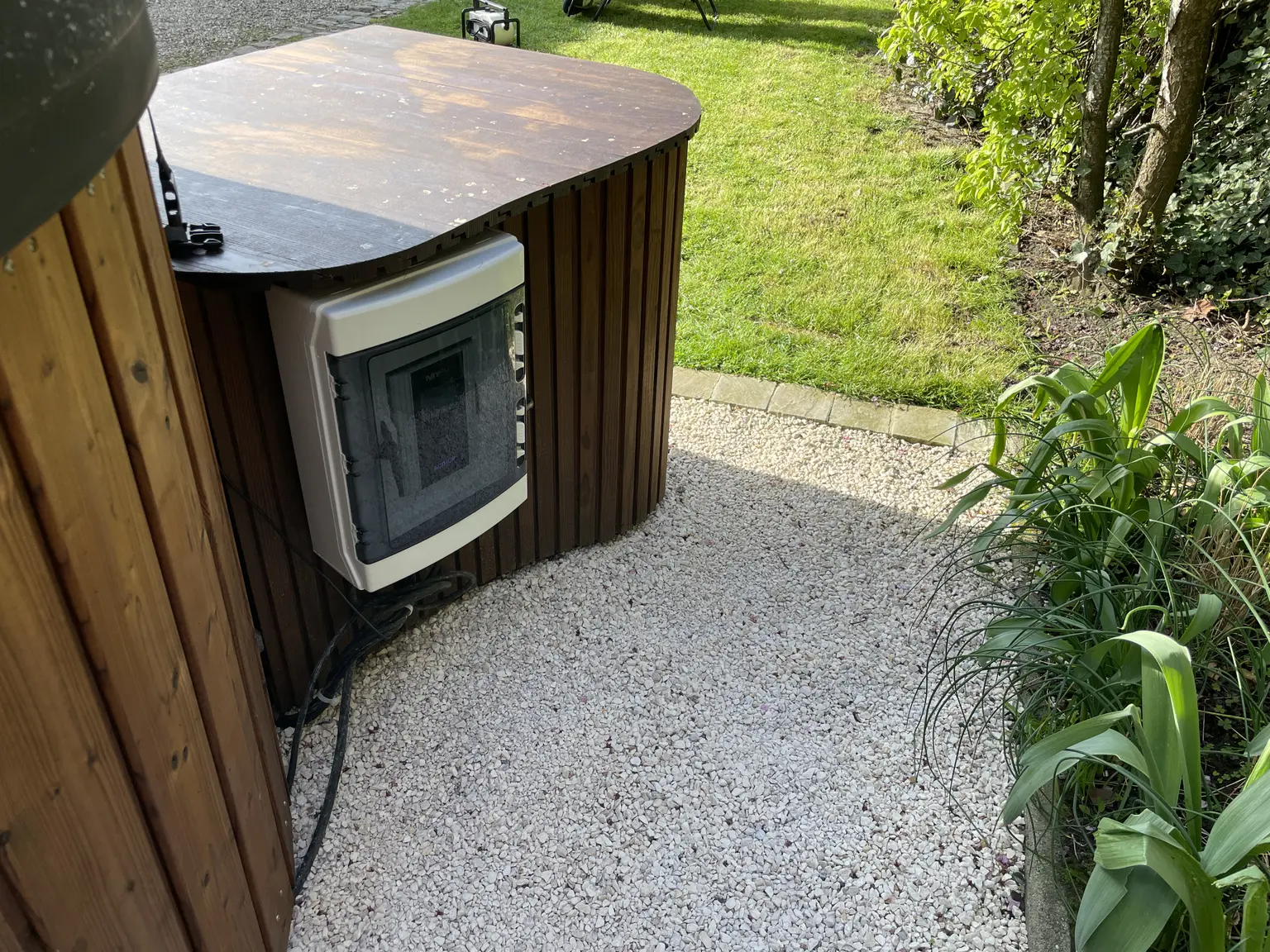 AC•THOR in a waterproof housing on a wooden structure with the jacuzzi pump to use surplus PV energy