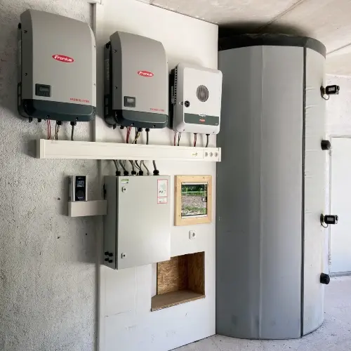 Water heater with four heating rods, two Fronius inverters, and an AC•THOR 9s.